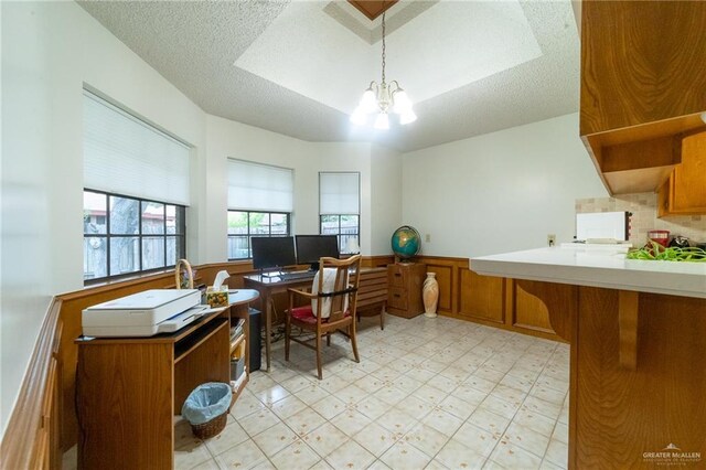 6913 N 31st St, Mcallen, TX 78504 - office area featuring a chandelier, wainscoting, light floors, and a textured ceiling