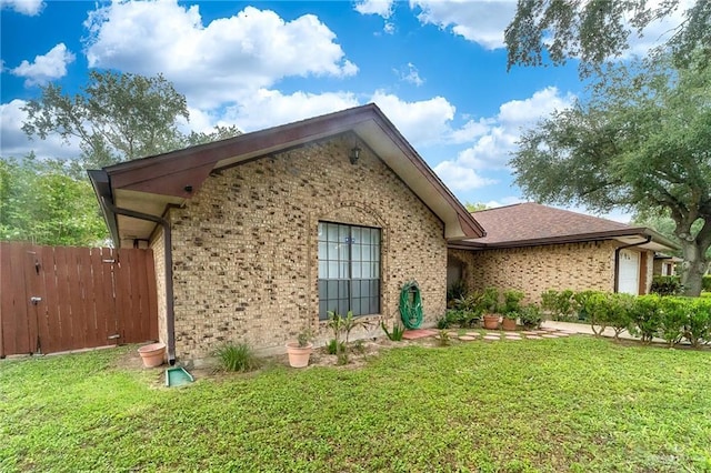 6913 N 31st St, Mcallen, TX 78504 - view of front of house featuring brick siding, an attached garage, and a gate