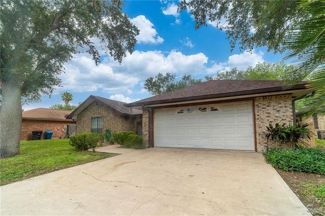 6913 N 31st St, Mcallen, TX 78504 - ranch-style house with driveway, an attached garage, brick siding, and a front yard