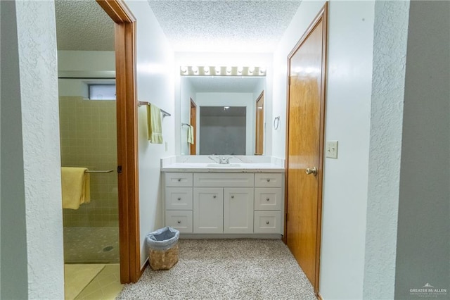 6913 N 31st St, Mcallen, TX 78504 - full bathroom with vanity, a textured ceiling, and a shower