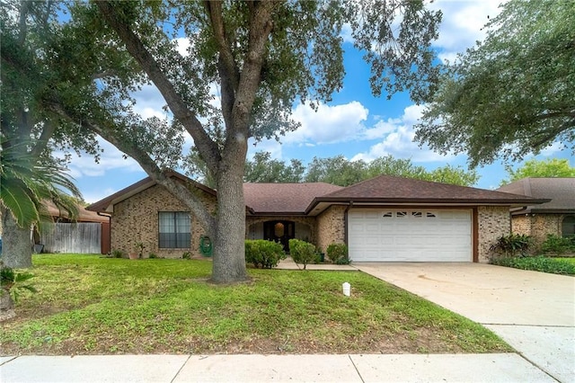 6913 N 31st St, Mcallen, TX 78504 - single story home with an attached garage, driveway, and brick siding