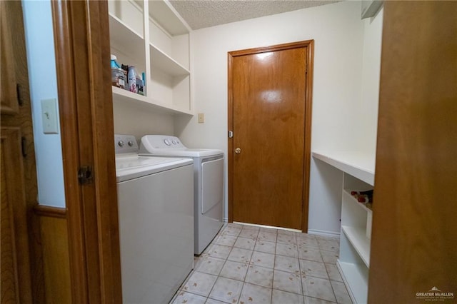6913 N 31st St, Mcallen, TX 78504 - laundry room featuring washing machine and clothes dryer and a textured ceiling