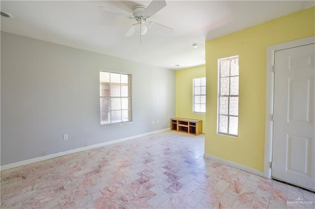 empty room featuring ceiling fan