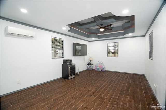 interior space featuring coffered ceiling, a ceiling fan, a healthy amount of sunlight, and a wall unit AC