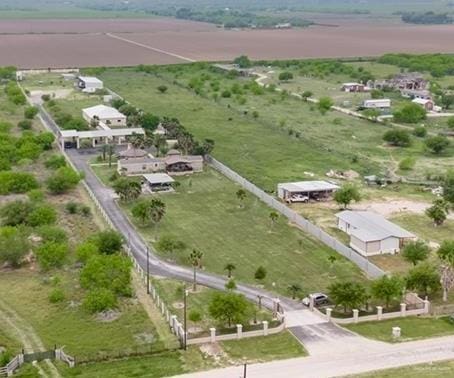 birds eye view of property with a rural view