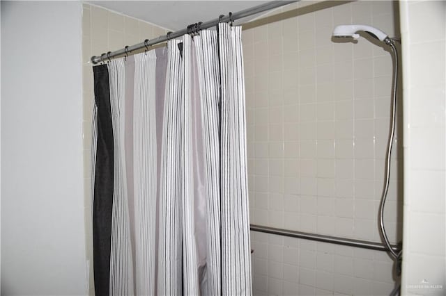 bathroom with a shower with shower curtain