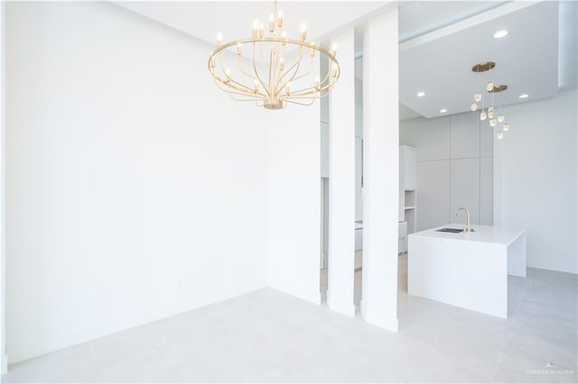 2607 Cottonwood St, Mission, TX 78574 - unfurnished dining area featuring a chandelier, a sink, and recessed lighting
