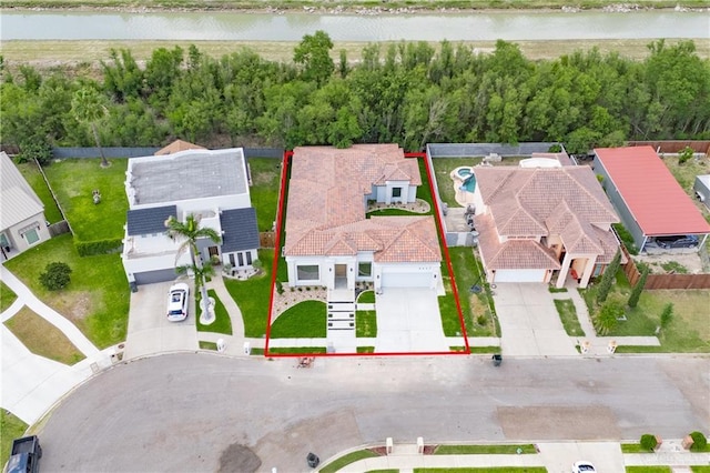2607 Cottonwood St, Mission, TX 78574 - aerial perspective of suburban area featuring property boundaries highlighted and a large body of water