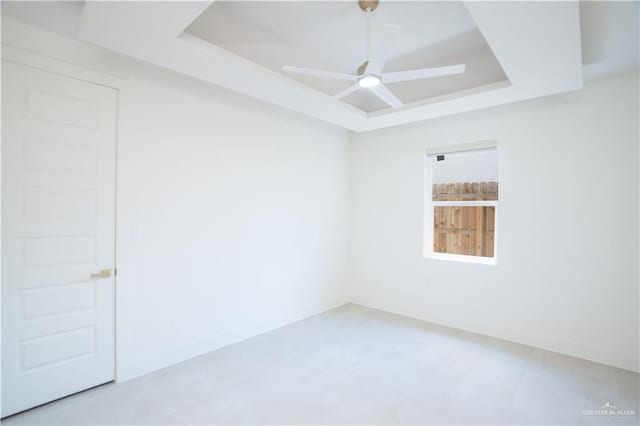 2607 Cottonwood St, Mission, TX 78574 - empty room with a tray ceiling, ceiling fan, and baseboards