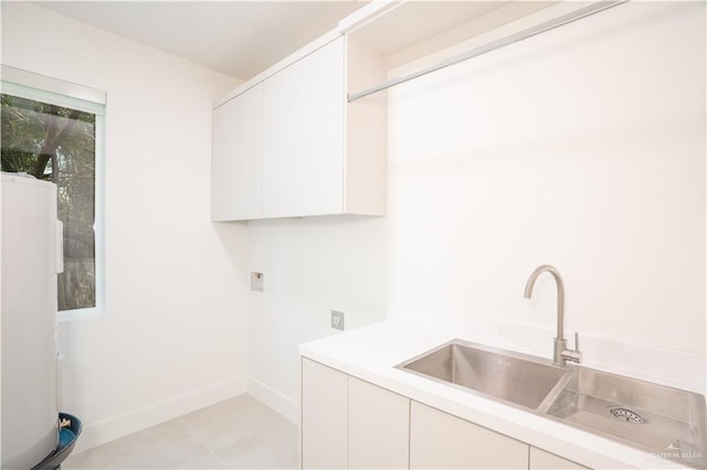 2607 Cottonwood St, Mission, TX 78574 - washroom featuring cabinet space, electric dryer hookup, baseboards, water heater, and washer hookup
