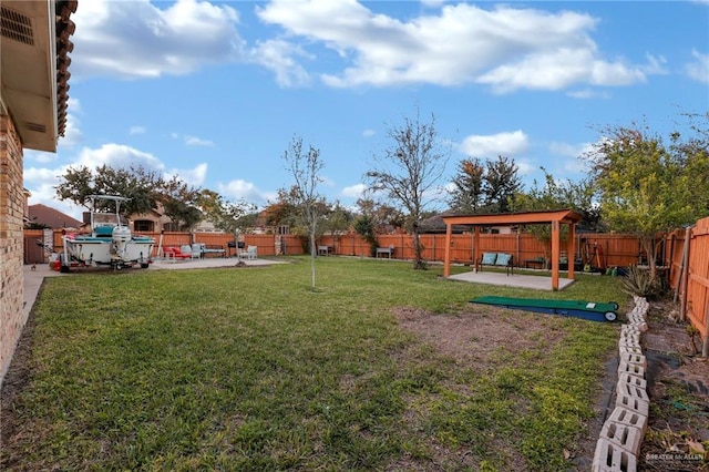 view of yard with a fenced backyard and a patio