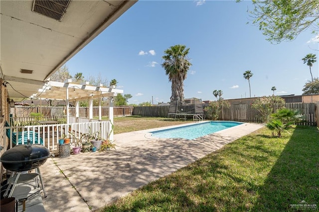 view of pool with a lawn, a patio, a trampoline, a fenced backyard, and a grill