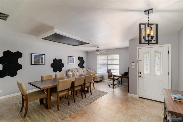 dining room with ceiling fan with notable chandelier, light tile patterned floors, baseboards, and visible vents