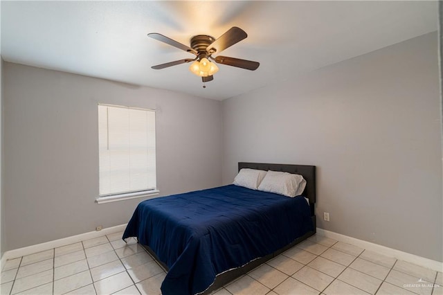 bedroom featuring light tile patterned floors, ceiling fan, and baseboards