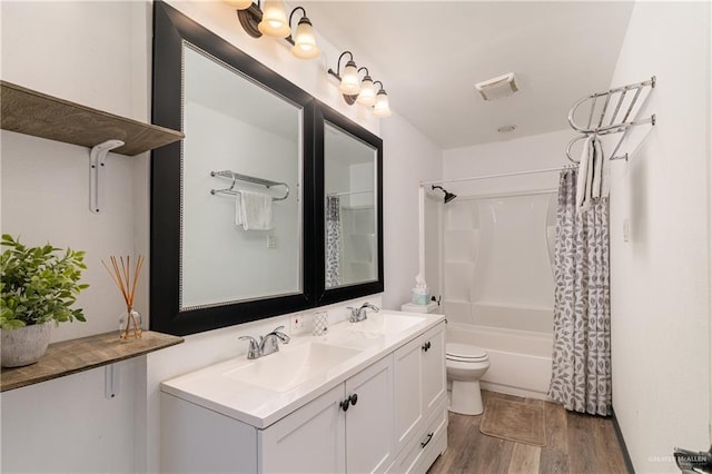 full bath featuring shower / bath combination with curtain, wood finished floors, double vanity, and a sink