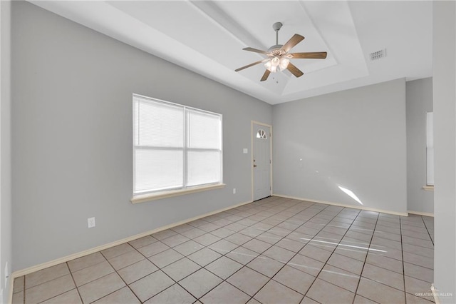 1010 Cedarwood Dr, Rio Grande City, TX 78582 - unfurnished room featuring a raised ceiling, ceiling fan, and light tile patterned floors