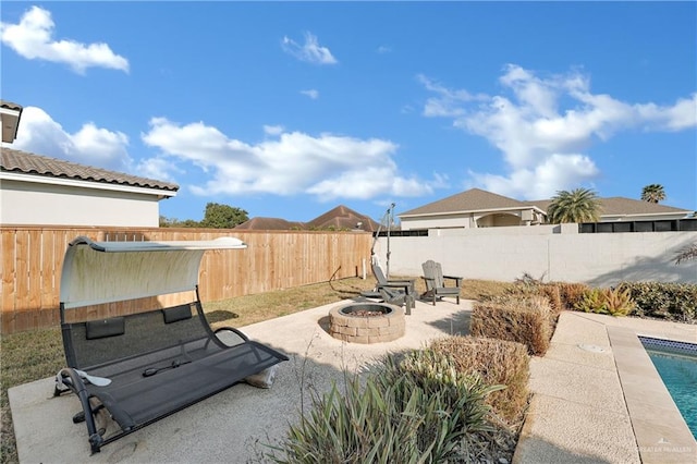 view of patio / terrace featuring a fire pit