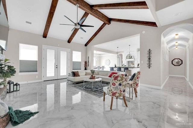 living room featuring french doors, ceiling fan, beam ceiling, and high vaulted ceiling