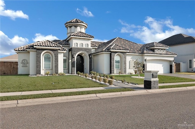 mediterranean / spanish-style house with a garage and a front yard