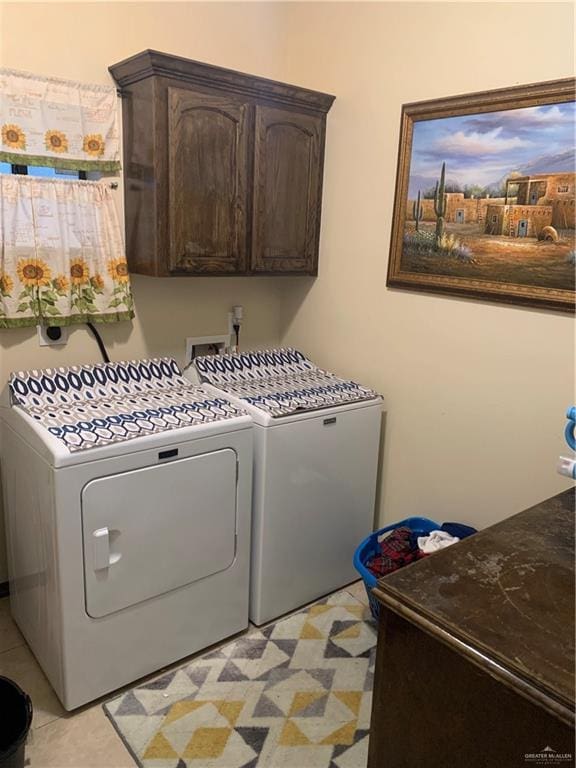laundry room featuring cabinet space and washing machine and clothes dryer