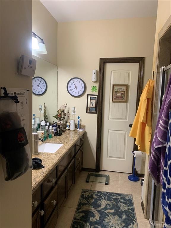 bathroom featuring tile patterned floors and vanity