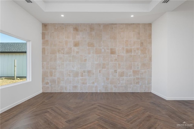 unfurnished room with dark parquet flooring