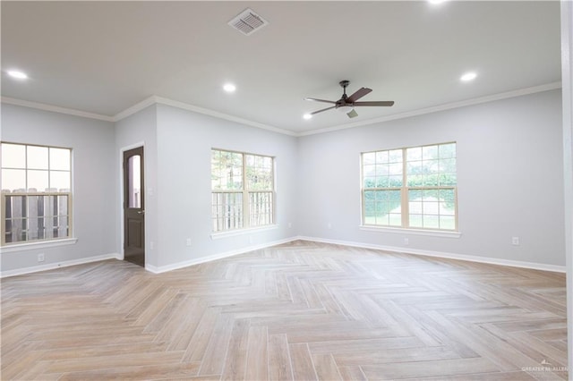 empty room with crown molding, light parquet flooring, a healthy amount of sunlight, and ceiling fan