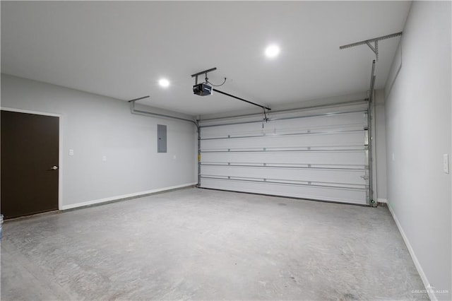 garage featuring electric panel and a garage door opener