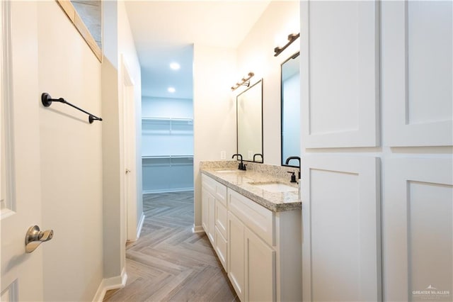 bathroom featuring vanity and parquet floors