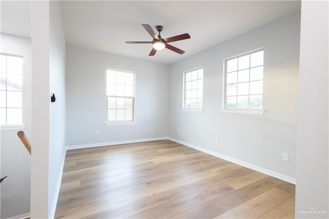 unfurnished room with ceiling fan, a healthy amount of sunlight, and light hardwood / wood-style flooring