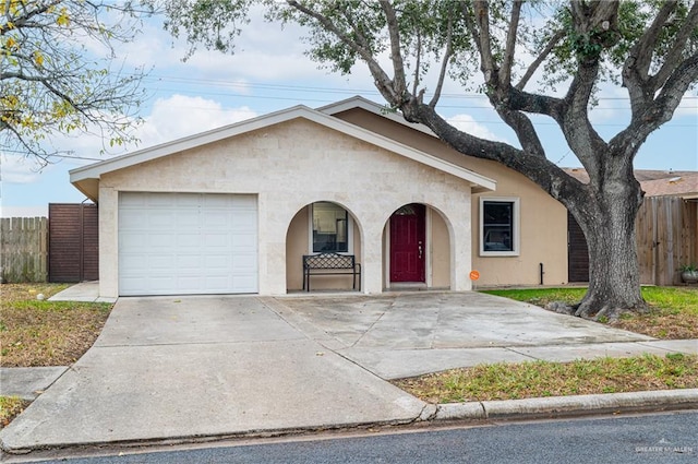 single story home featuring a garage