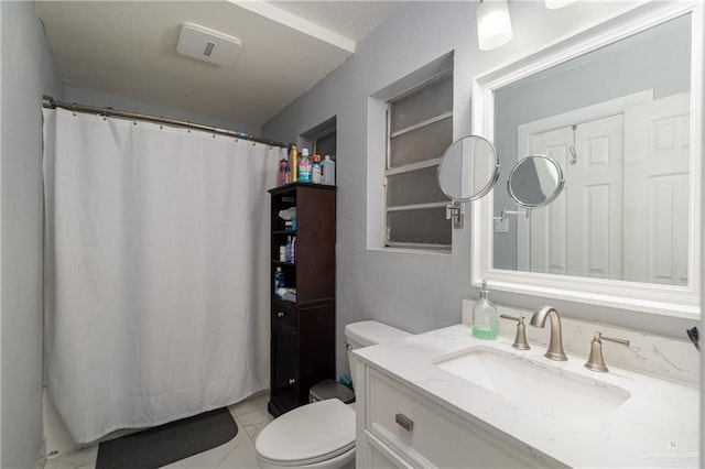 bathroom with a shower with shower curtain, vanity, toilet, and tile patterned flooring