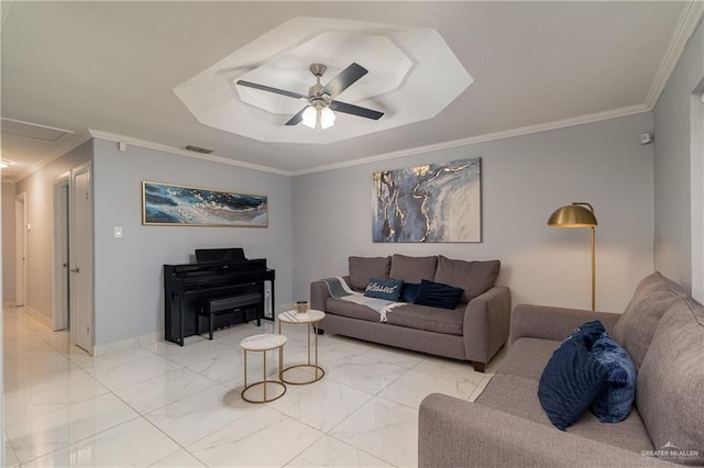 living room featuring a tray ceiling, ornamental molding, and ceiling fan