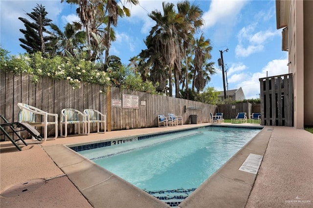 103 Gardenia St Unit 3, South Padre Island, TX 78597 - view of pool featuring a patio area and a fenced backyard