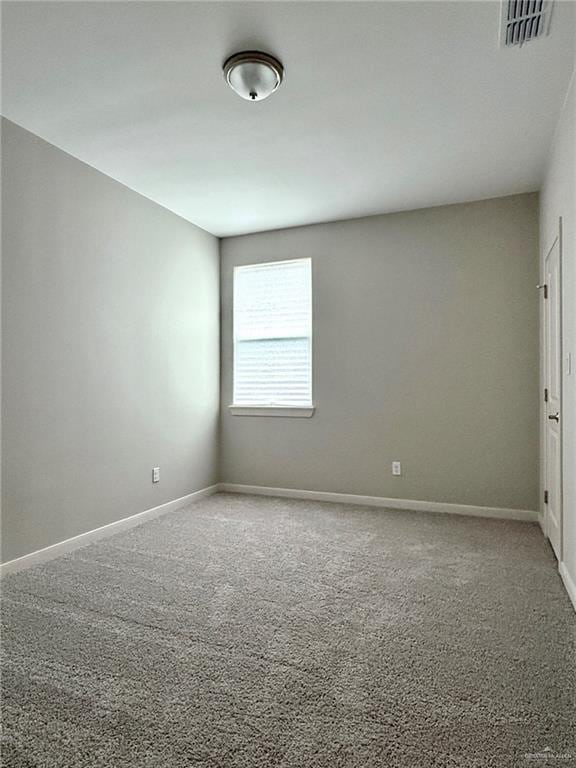 spare room featuring carpet flooring