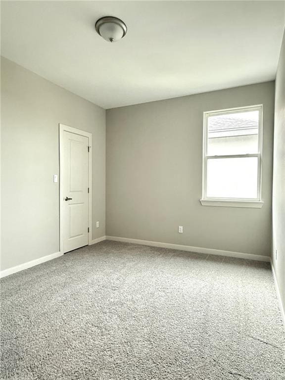 unfurnished room with carpet floors