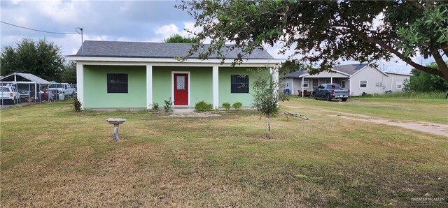 view of front of house with covered porch and a front yard