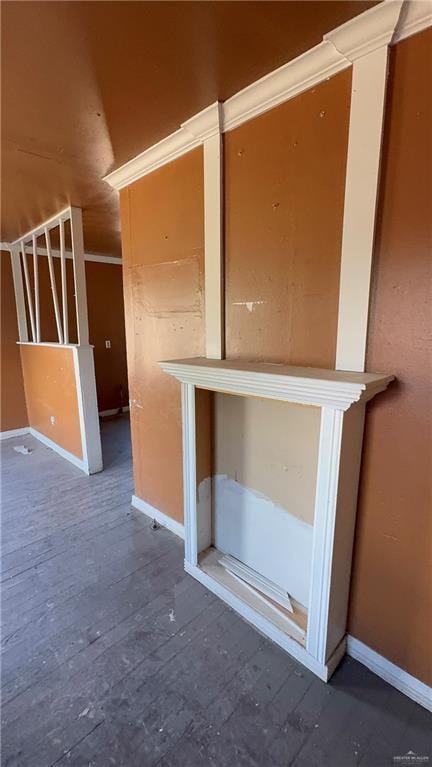 interior space with baseboards and hardwood / wood-style floors