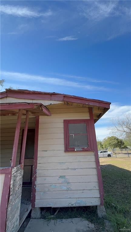 view of side of home featuring a yard