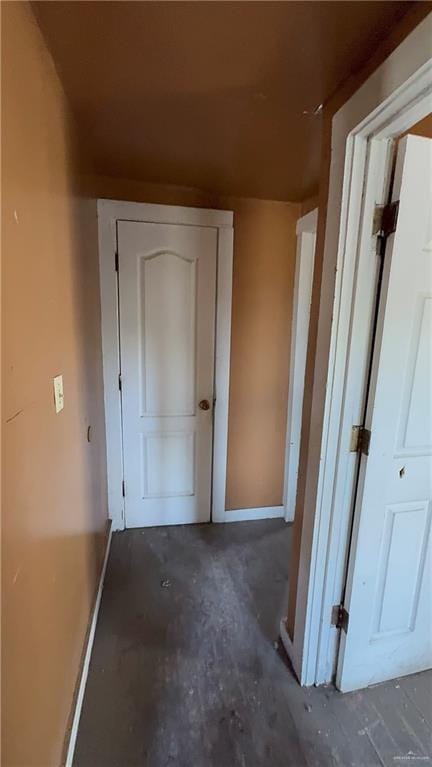 hallway with concrete floors