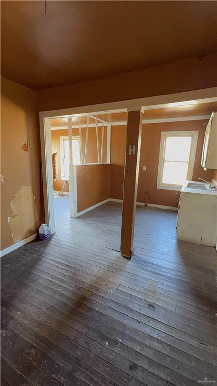 interior space with dark wood-style floors and baseboards