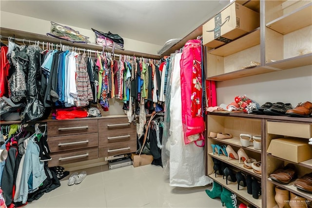 spacious closet featuring tile patterned floors