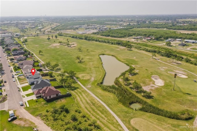 birds eye view of property with golf course view