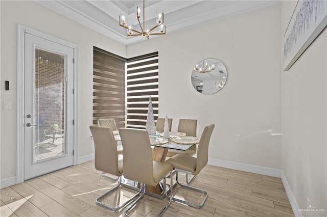 dining area with a chandelier and light hardwood / wood-style floors