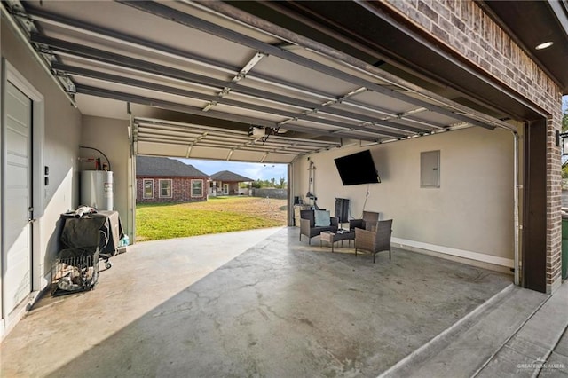 garage with a yard, electric panel, a garage door opener, and water heater