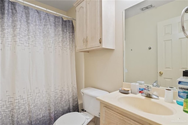 full bathroom featuring shower / bath combination with curtain, vanity, and toilet