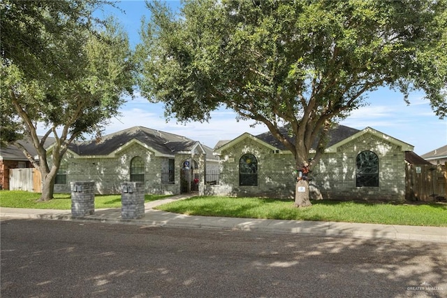 ranch-style house with a front yard