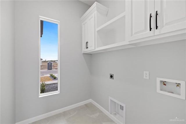 laundry room with cabinets, hookup for an electric dryer, and hookup for a washing machine