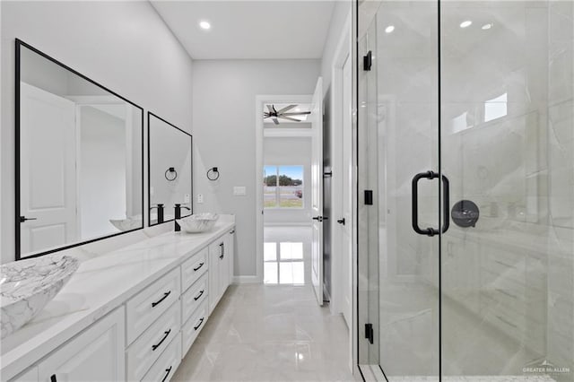 bathroom with ceiling fan, a shower with shower door, and vanity