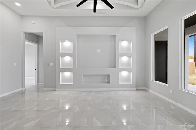 unfurnished living room with ceiling fan